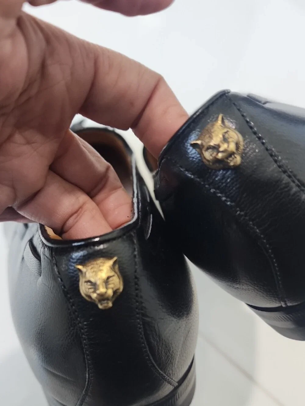 Gucci Black Leather Tassel Loafers with Gold Cat Accent